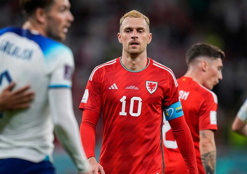 Wales' Aaron Ramsey walks along the pitch at the end of the World Cup group B soccer match between England and Wales, at the Ahmad Bin Ali Stadium in Al Rayyan, 
