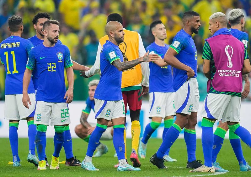 Brazilian players greet each other at the end of the World Cup group G soccer 