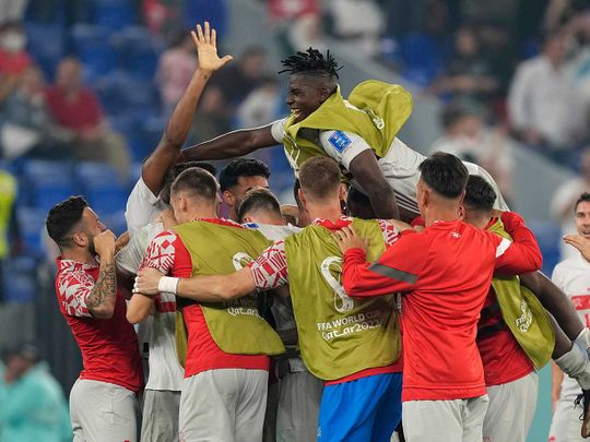 Switzerland's players celebrate after winning the World Cup group G 
