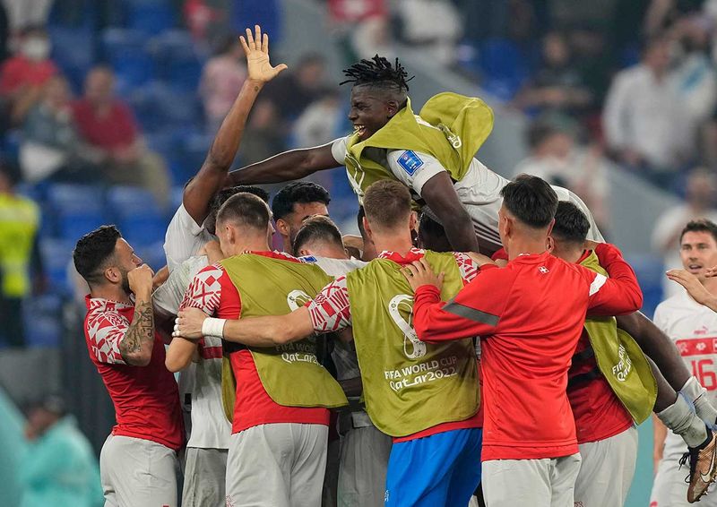 Switzerland's players celebrate after winning the World Cup group G 