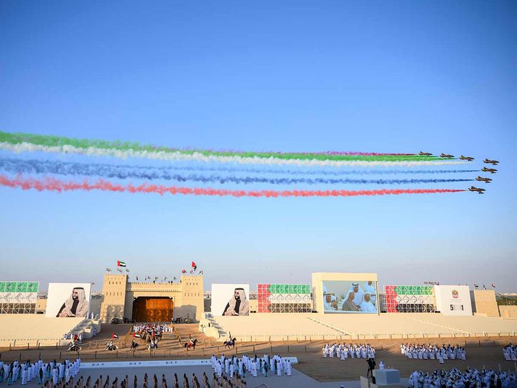 The Al Forsan Aerobatic team perform a flyover during the ‘March of the Union’ parade. 