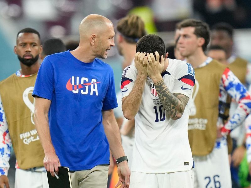 US Head coach Gregg Berhalter and player Christian Pulisic leave the pitch at the end of the Qatar World Cup round of 16 match against Netherlands, at the Khalifa International Stadium in Doha, on Saturday, December 3, 2022. 