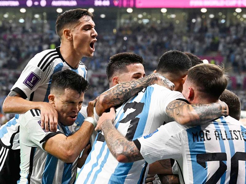 Argentina players celebrates after Lionel Messi scored his team's first goal during the Qatar World Cup round of 16 match against Argentina at the Ahmad Bin Ali Stadium in Al Rayyan, west of Doha on December 3, 2022. 