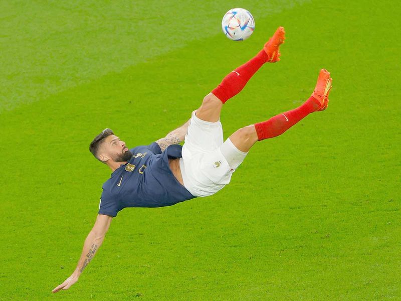 France's forward Olivier Giroud kicks the ball during the Qatar World Cup round of 16 match against Poland at the Al Thumama Stadium in Doha. 