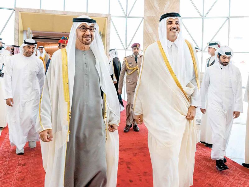 President Sheikh Mohamed bin Zayed Al Nahyan being received by Qatari Emir Sheikh Tamim bin Hamad Al-Thani in Doha on Monday.