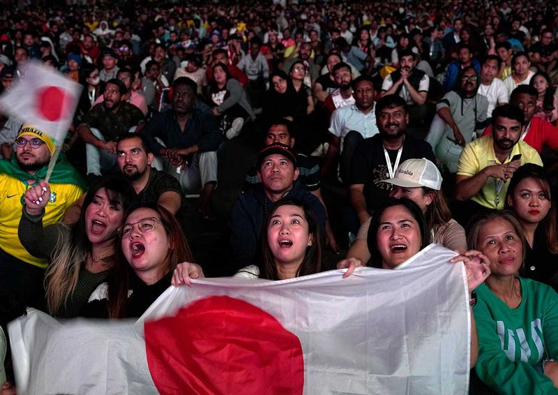 Fans watch the World Cup round of 16 soccer match between Japan and Croatia
