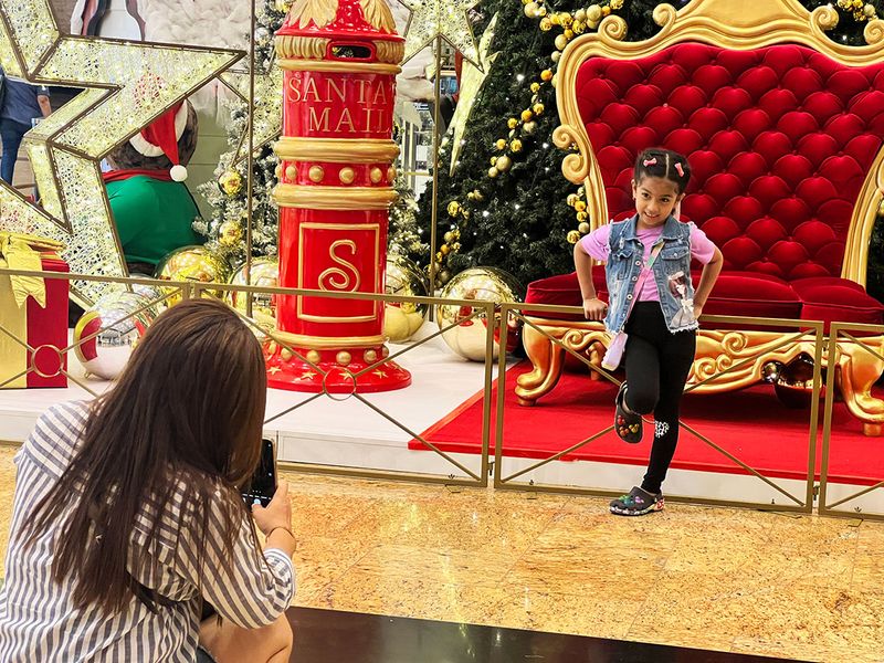 Visitors enjoy the Christmas decoration and the make the most of festive discounts at the Mall of the Emirates on 8th December, 2022. 