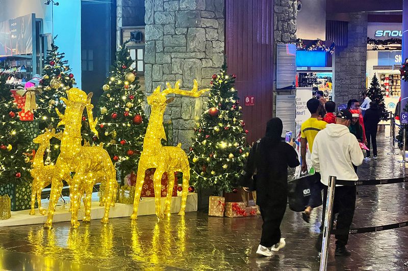 Visitors enjoy the Christmas decoration and the make the most of festive discounts at the Mall of the Emirates on 8th December, 2022.
