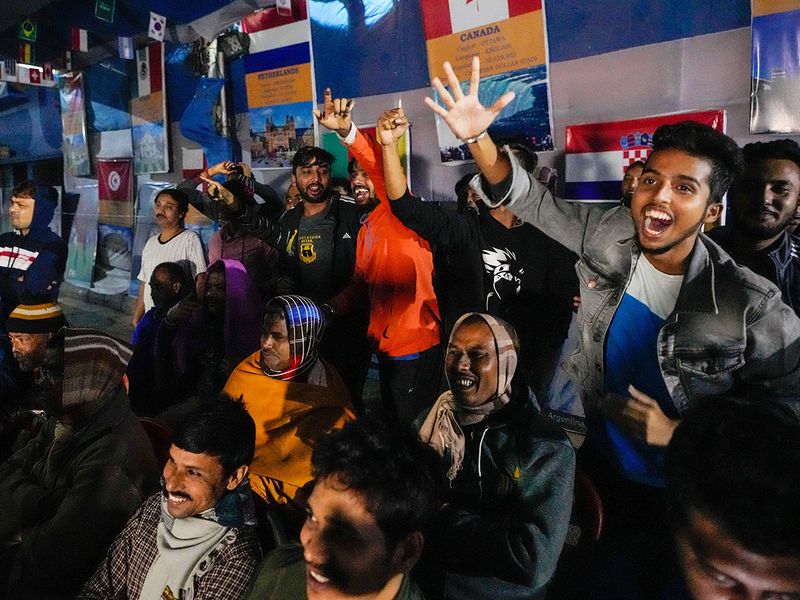 Indian fans of Argentina cheer for their team's victory 