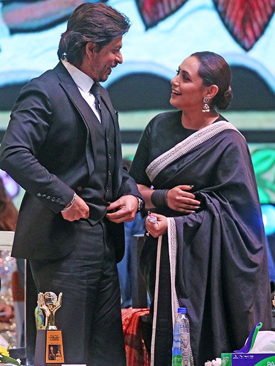  Bollywood actors Shah Rukh Khan and Rani Mukerjee interact with each other during the inaugural programme of the 28th Kolkata International Film Festival, in Kolkata on Thursday.