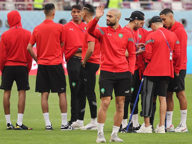 Morocco's midfielder Sofyan Amrabat (C) waves to the fans prior to the Qatar World Cup third place play-off match against Croatia at Khalifa International Stadium in Doha on December 17, 2022. 