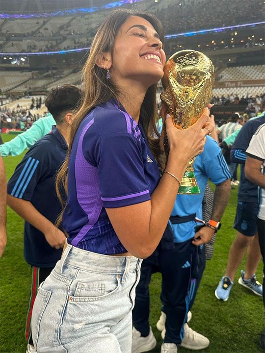 Argentina's captain and forward 10 Lionel Messi's wife Antonela Roccuzzo  hold the world cup