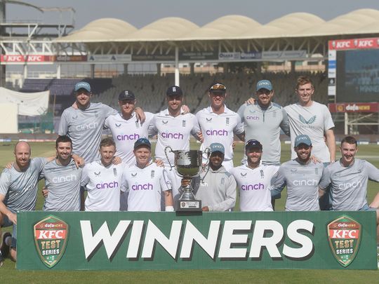 England's cricketers pose with the trophy