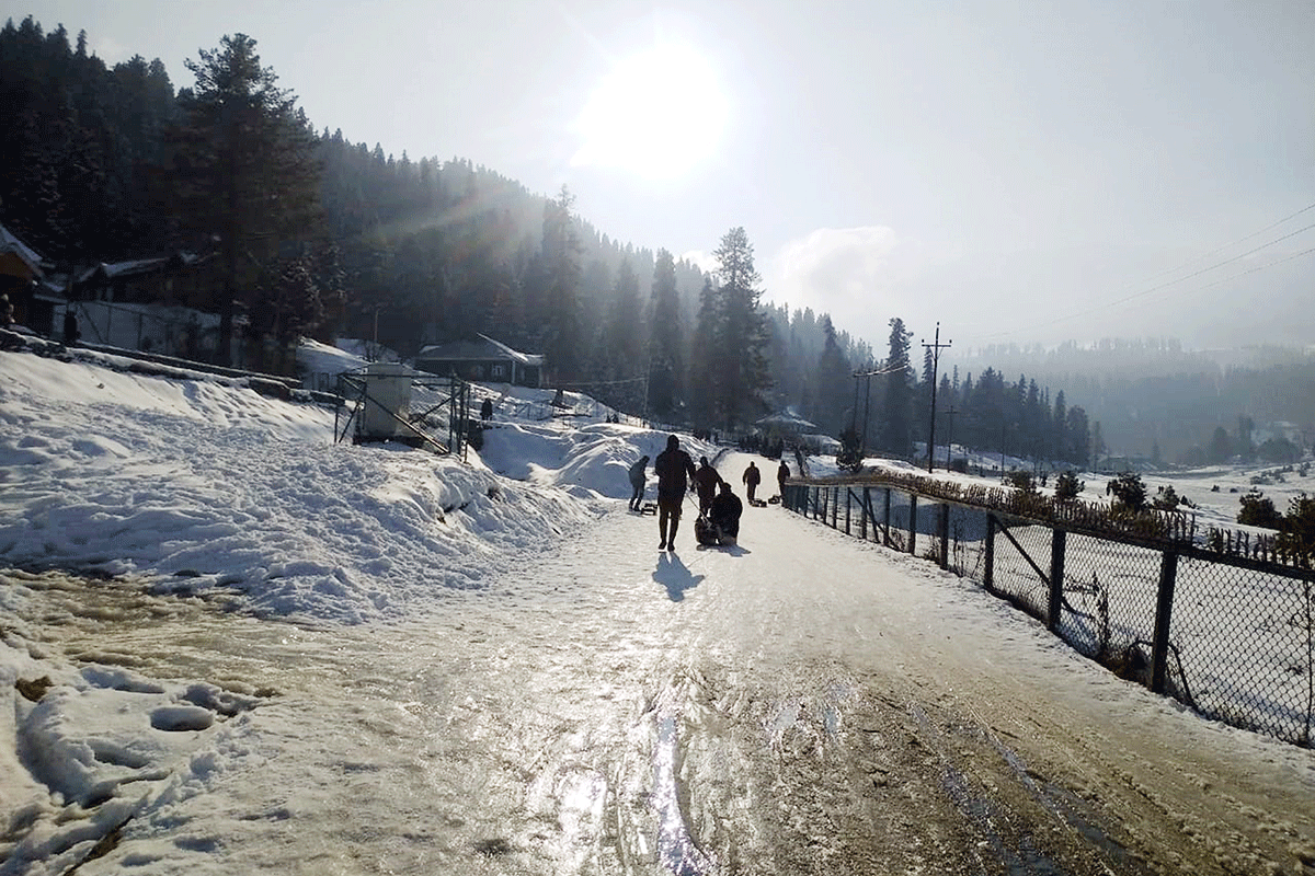 Tourists enjoy snow-covered Gulmarg Ski Resort following the snowfall in the upper reaches of Kashmir Valley, on Wednesday.