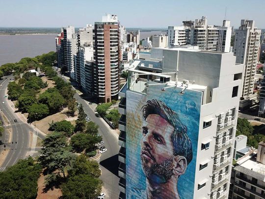 Lionel Messi mural covers a building near the Paraná river in Rosario, Argentina