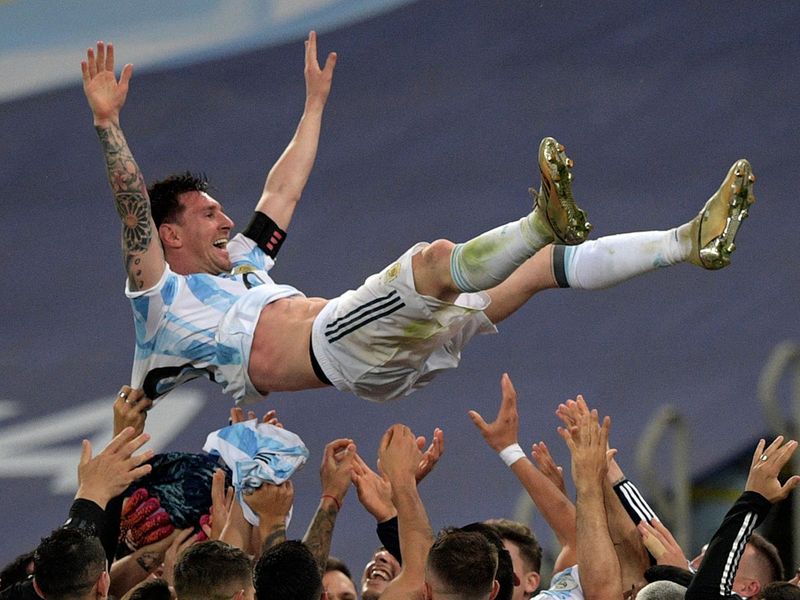 Argentina's Lionel Messi is thrown into the air by teammates after winning the Copa America final against Brazil at Maracana Stadium in Rio de Janeiro