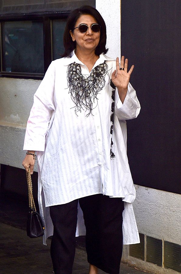 Bollywood actress Neetu Kapoor arrives to attend annual Christmas lunch hosted by Kunal Kapoor, in Mumbai on Sunday.
