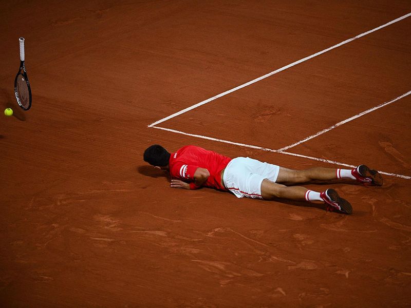 Novak Djokovic reacts after winning the French Open 