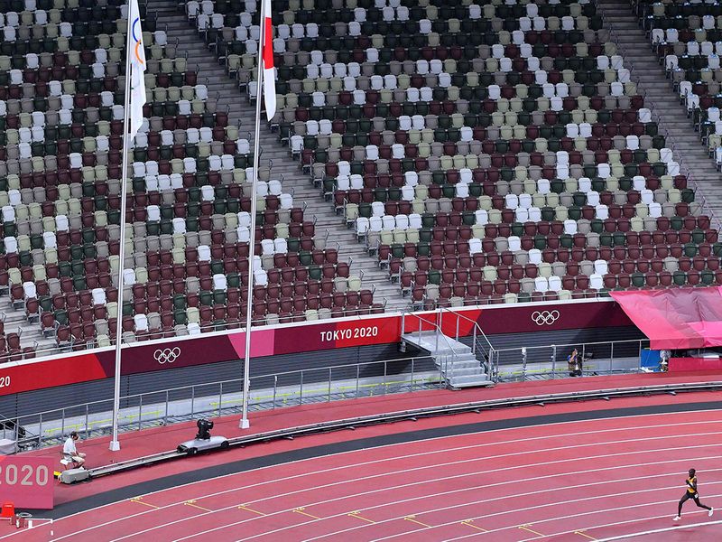 Uganda's Stephen Kissa cuts a lonely figure in the men's 10,000m final at an empty Olympic Stadium during the Tokyo 2020 Olympic Games 