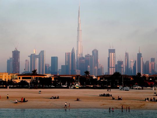 STOCK Dubai skyline economy tourists