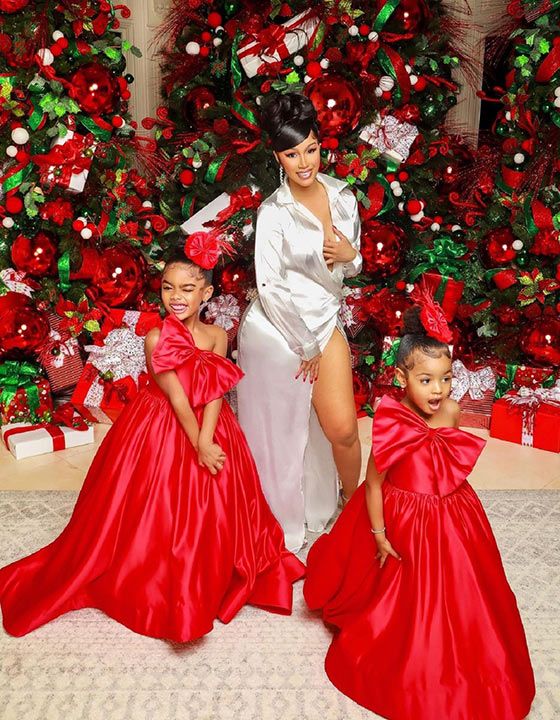 Singer Cardi B, 29, also had a Christmas-themed photoshoot. She posed in front of glorious Christmas tree with her daughter Kulture, and her step-daughter, Kalea. Her husband Offset was missing from the photo. 