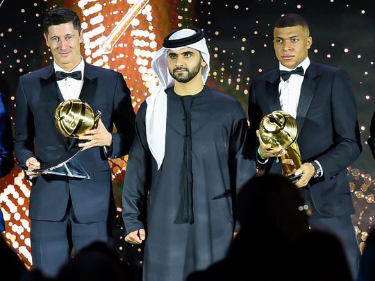 Kylian Mbappe and Robert Lewandowski with Sheikh Mansoor bin Mohammed bin Rashid Al Maktoum at the Dubai Globe Soccer Awards 