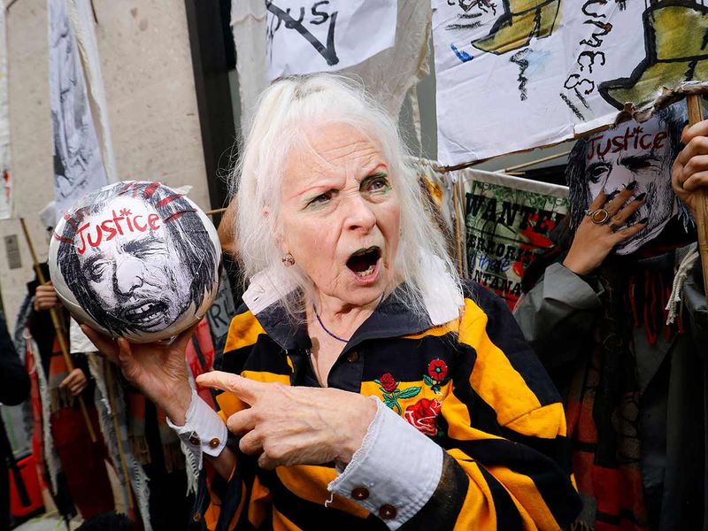  British designer Vivienne Westwood reacts outside of the Old Bailey court, in central London, in protest of the extradition trial of Wikileaks founder Julian Assange.