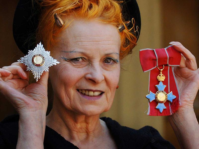 Dame Vivienne Westwood poses for a photo after collecting her insignia from Britain's Prince Charles during an Investiture ceremony at Buckingham Palace, London on June. 9, 2006. 