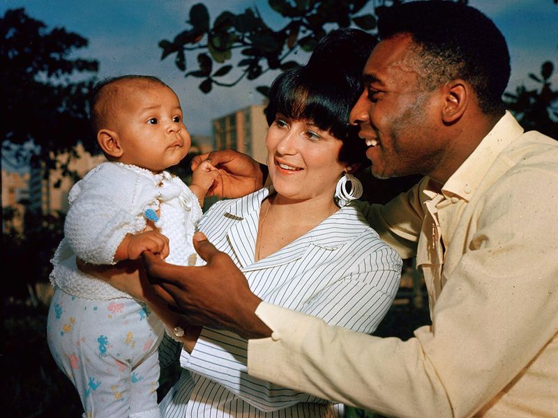 FILE - Brazilian soccer star Pele and his wife Rosemeri pose for a photo with their daughter Kelly, in an unknown location, June 1967. 