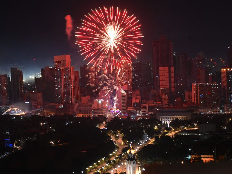 Fireworks light up the sky over Jones Bridge in Manila during New Year celebrations  