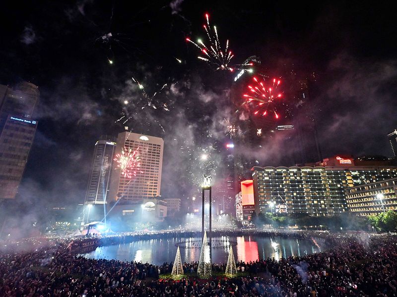 Fireworks over the Selamat Datang (Welcome) Monument during New Year celebrations at the Hotel Indonesia roundabout in Jakarta  