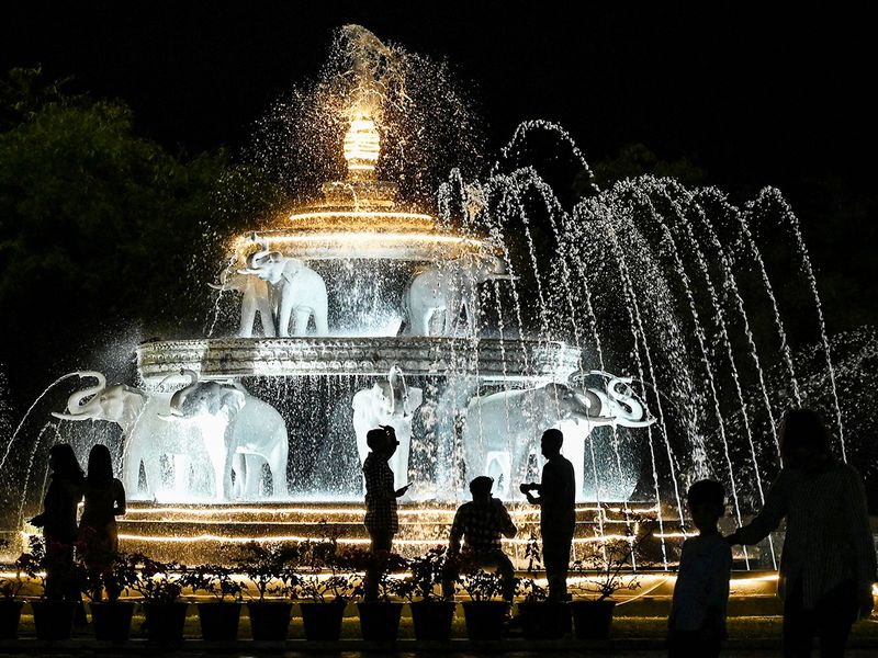 Revellers gather to take part in New Year celebrations at a public park in Yangon