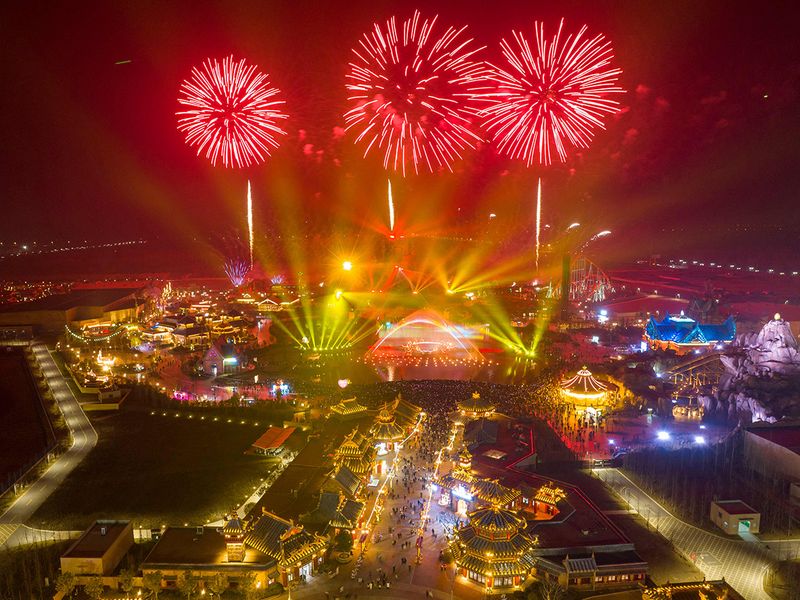 This aerial photo shows fireworks lighting up the sky over the Xiyou World theme park during New Year celebrations in Huaian, in China's eastern Jiangsu province 