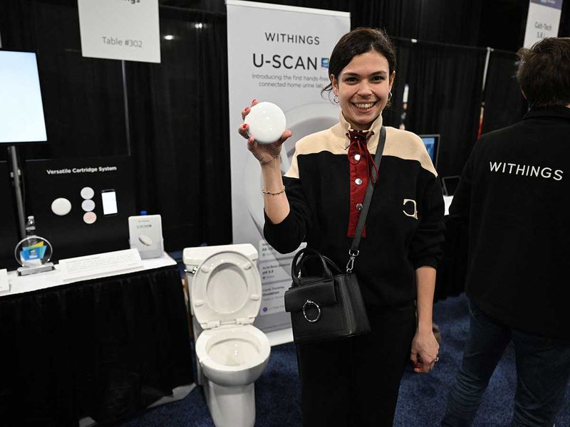 Withings representative Asmirian Albisson displays the U-Scan, during CES Unveiled ahead of the Consumer Electronics Show (CES) on January 3, 2023 in Las Vegas, Nevada. 