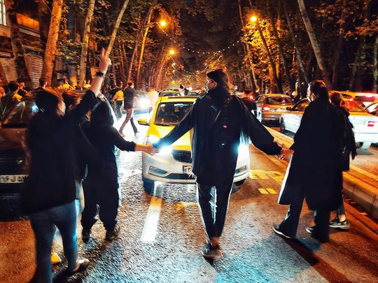File photo:  Women protest the death of 22-year-old woman Mahsa Amini who was detained by the morality police, in Tehran, on Saturday, October 1, 2022. 
