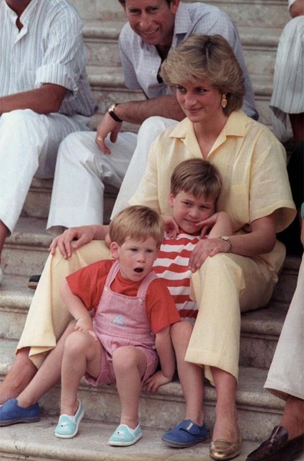 Princess Diana holds her two sons Prince William, 6, and Prince Harry, 3, in Palma de Mallorca, Spain, August 1987. 