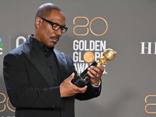 US actor Eddie Murphy poses with the Cecil B. DeMille award in the press room during the 80th annual Golden Globe Awards at The Beverly Hilton hotel in Beverly Hills, California, on January 10, 2023.
