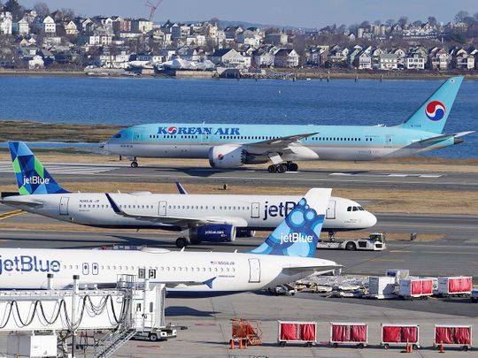 Passenger jets are seen on the tarmac at Logan International Airport, in Boston. 