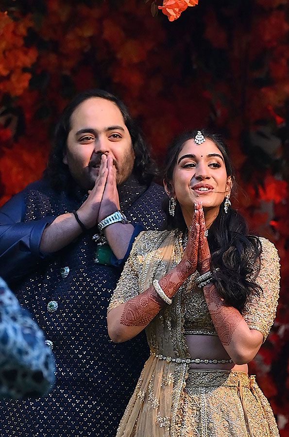 Anant Ambani (L), the son of Indian billionaire Mukesh Ambani, poses with his fiancée Radhika Merchant during their engagement ceremony in Mumbai on January 19, 2023.