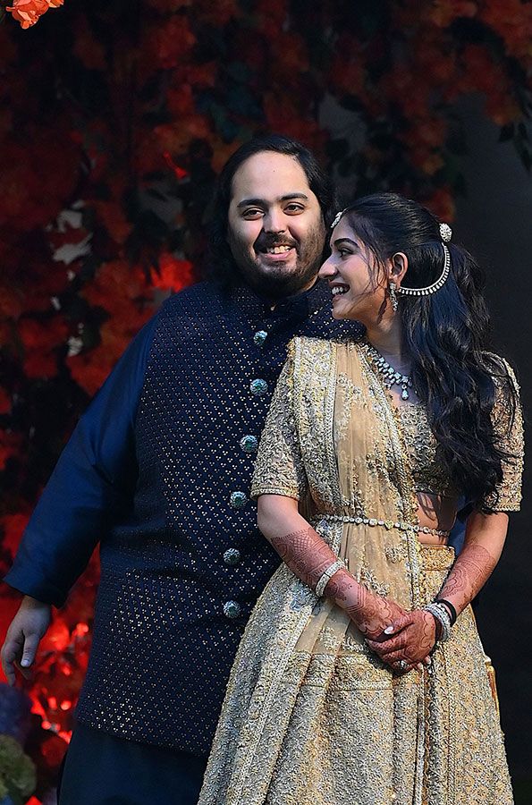 Anant Ambani (L), the son of Indian billionaire Mukesh Ambani, poses with his fiancée Radhika Merchant during their engagement ceremony in Mumbai on January 19, 2023.