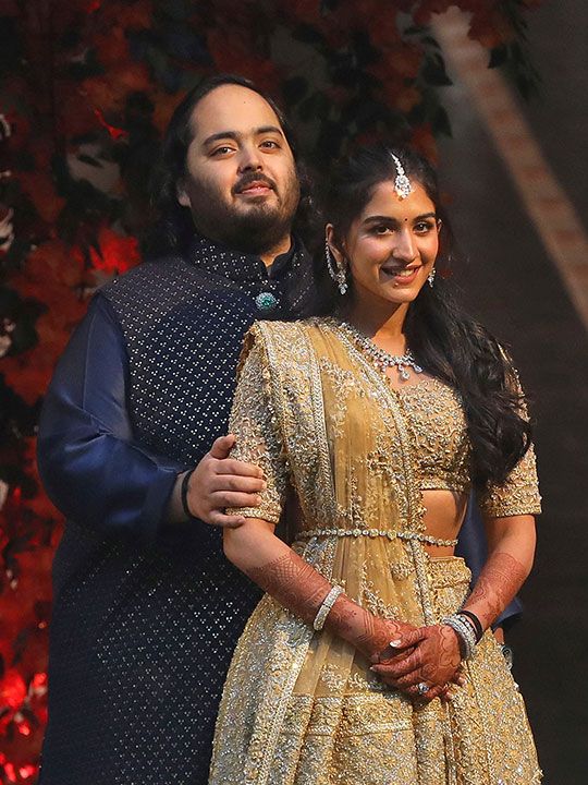 Anant Ambani, son of Mukesh Ambani, the Chairman of Reliance Industries, and Radhika Merchant, daughter of Encore Healthcare CEO Viren Merchant, pose during a photo opportunity at the Red Carpet ceremony to celebrate their engagement at Ambani's Antilia residence in Mumbai, India, January 19, 2023.
