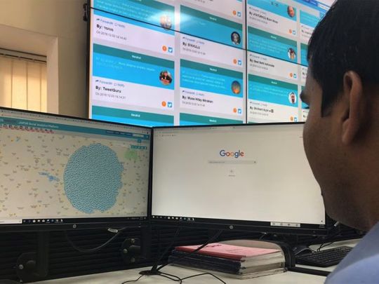 File photo: An officer looks at computer screens inside a police war room setup to monitor social media posts in Jaipur in the state of Rajasthan.  