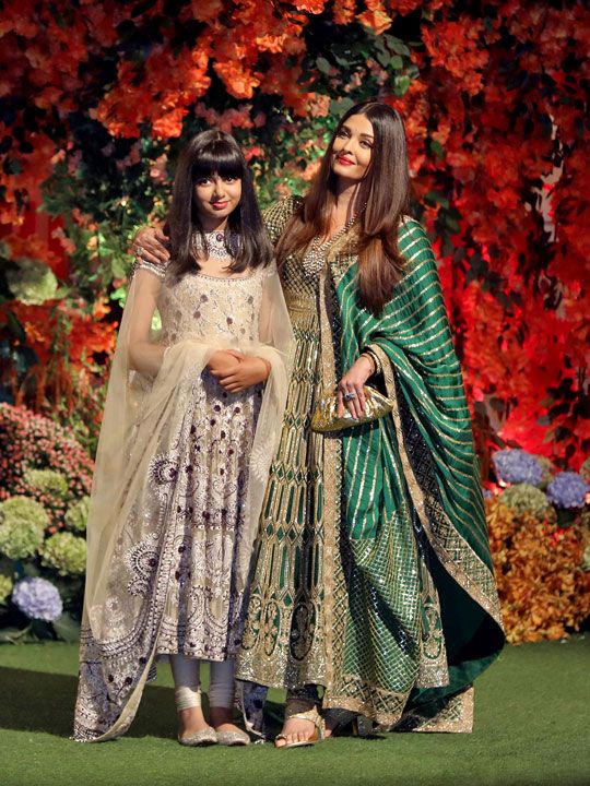 Actor Aishwarya Rai and her daughter Aaradhya pose during a photo opportunity as they arrive to attend engagement ceremony of Anant Ambani, son of Mukesh Ambani, the Chairman of Reliance Industries, and Radhika Merchant, daughter of Encore Healthcare CEO Viren Merchant, at Ambani's Antilia residence in Mumbai, India, January 19, 2023. 