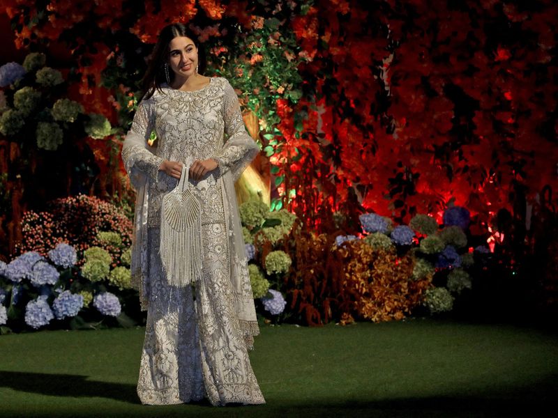 Actor Sara Ali Khan poses during a photo opportunity as she arrive to attend the engagement ceremony of Anant Ambani, son of Mukesh Ambani, the Chairman of Reliance Industries, and Radhika Merchant, daughter of Encore Healthcare CEO Viren Merchant, at Ambani's Antilia residence in Mumbai, India, January 19, 2023. 