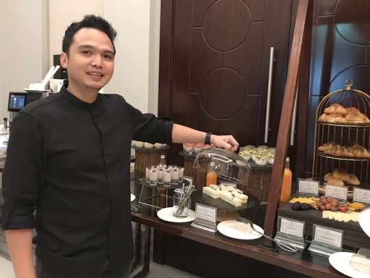 Russell Tuazon started as hotel staff serving at banquets-1674560896629