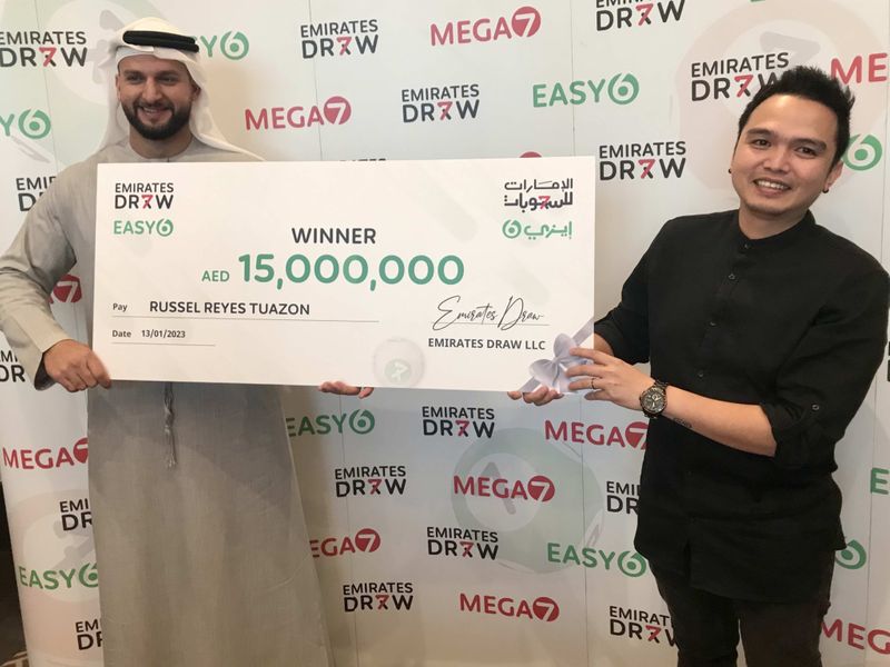 winner with Mohammad Behroozian Al Awadhi_managing partner at Emirates Draw-1674560900461