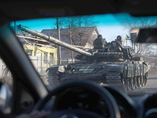 Ukrainian servicemen ride a T-80 tank not far from Lyman, Donetsk region