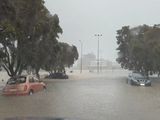 Cars are seen in a flooded street during heavy rainfall in Auckland, New Zealand. 