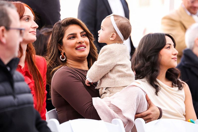Priyanka Chopra holds her and Nick Jonas' daughter, Malti, during the ceremony where the Jonas Brothers will unveil their star on The Hollywood Walk of Fame in Los Angeles, California, U.S., January 30, 2023. 