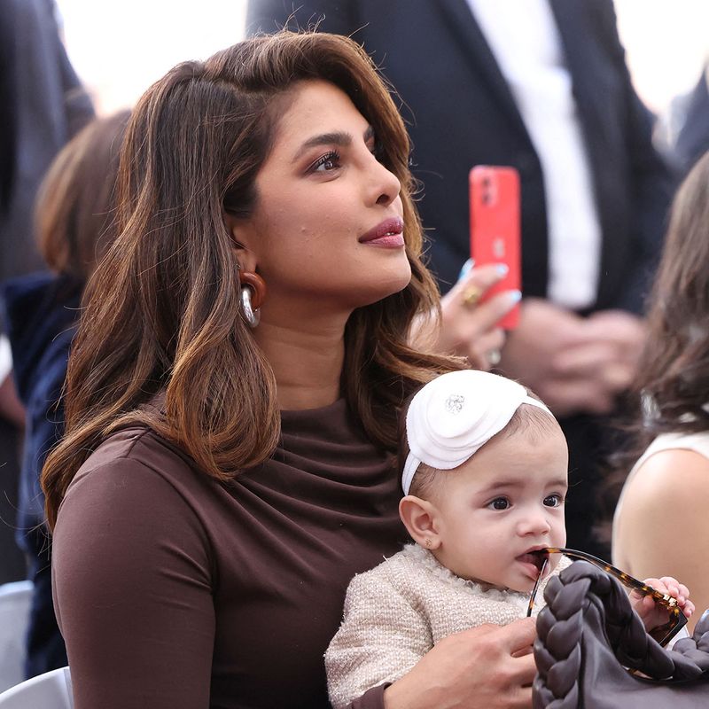 Priyanka Chopra holds her and Nick Jonas' daughter, Malti, during the ceremony where the Jonas Brothers will unveil their star on The Hollywood Walk of Fame in Los Angeles, California, U.S., January 30, 2023.